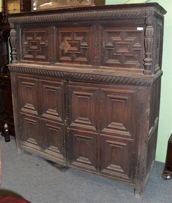 Lot 1438 - ^ A late 17th century oak press cupboard, with geometric moulded cupboard doors, 174cm wide