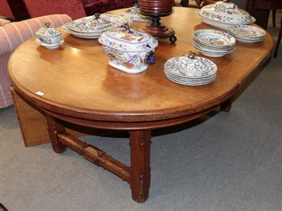 Lot 1444 - A late Victorian oak extending table by James Rodwell, with two additional leaves, raised on square