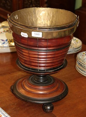 Lot 1445 - ^ A 19th century Dutch turned and ebonised peat bucket, with brass liner, lifting handle, 40cm high