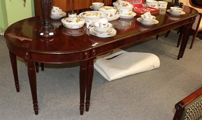 Lot 1449 - An early 20th century mahogany D end dining table with reeded legs, 305cm by 106cm wide by 75cm...