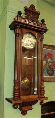 Lot 1451 - A Vienna type walnut veneered double weight driven striking wall clock, circa 1890