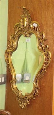 Lot 1460 - Bevelled glass cartouche shaped mirror