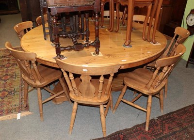 Lot 1463 - ^ A Victorian pine eight/ten seater circular kitchen table, raised on three column supports and...