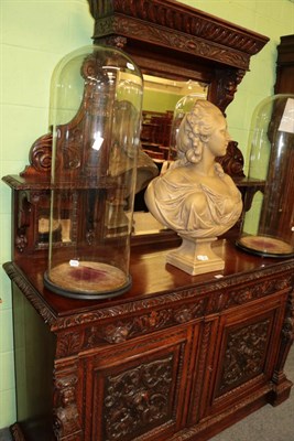 Lot 1464 - ^ A late Victorian carved oak mirror backed sideboard, the base with two drawers above two cupboard