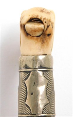 Lot 95 - Sporting: A Malacca Riding Crop Whistle, the antler pommel carved as a dogs head with whistle, with