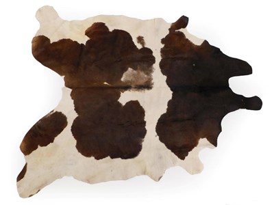 Lot 124 - Hides/Skins; A High Quality Cow Hide Floor Rug, modern, with dark brown and white patination,...