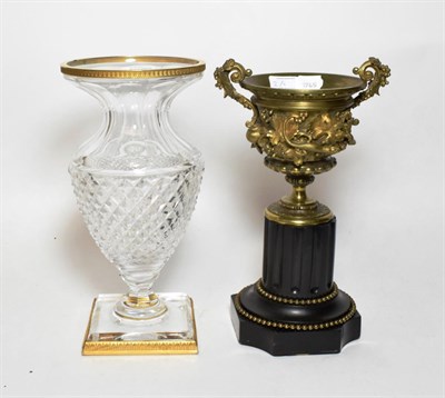 Lot 2 - A 19th century French gilt bronze urn on slate socle; and an ormolu mounted cut glass vase