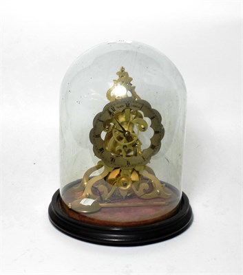 Lot 10 - A brass skeleton mantel timepiece, chapter ring signed Smith, London, beneath glass dome