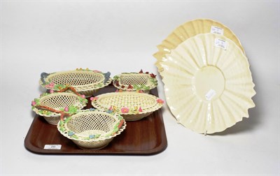 Lot 20 - A collection of Belleek comprising five floral decorated baskets and a pair of plates