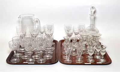 Lot 27 - Two trays of drinking glasses including thistle form glasses, jug, decanter etc