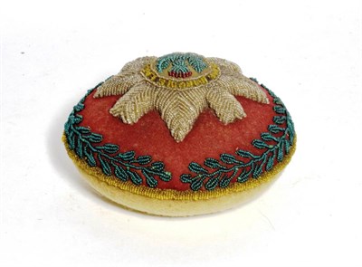 Lot 34 - An early 20th century beadwork pin cushion to the Scots Guards, of circular form, worked with...