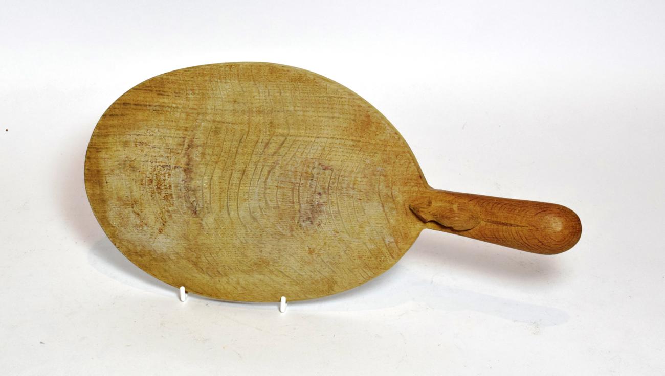 Lot 59 - A Robert 'Mouseman' Thompson of Kilburn English oak cheese board, with carved mouse signature...