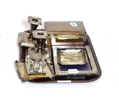 Lot 71 - A silver cigarette case, pair of candlesticks, photo frame, ink stand and pin tray, various...