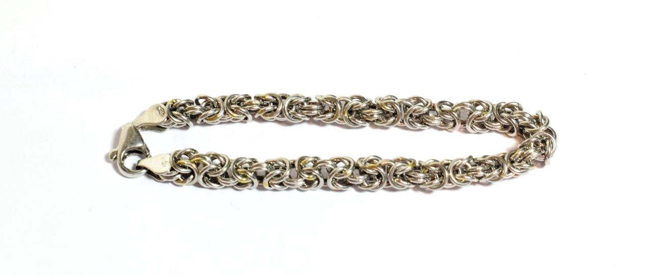 Lot 80 - A platinum fancy link bracelet, length 19cm