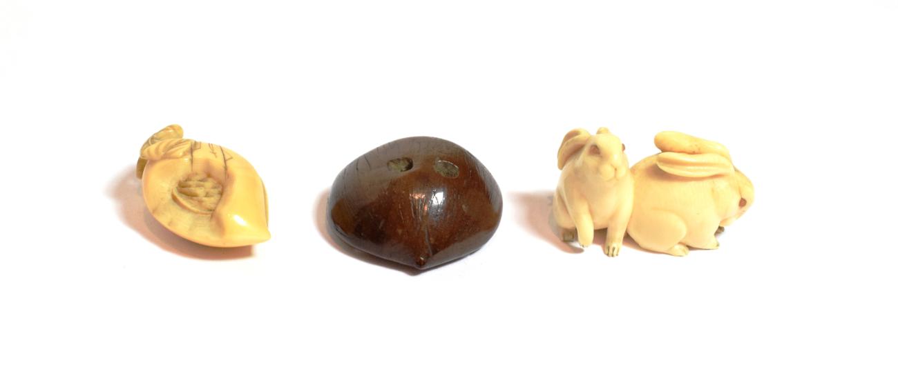 Lot 81 - A Japanese ivory netsuke, Meiji period (1868-1912) in the form of two hares, with amber eyes, 4.5cm
