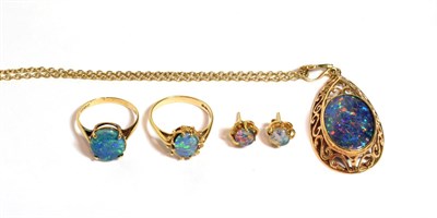 Lot 84 - A suite of opal triplets comprising a pendant on chain, a pair of stud earrings and two 9 carat...