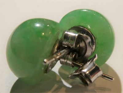 Lot 89 - A pair of jade stud earrings, unmarked; a pair of red stone earrings, unmarked; and pair of 9 carat