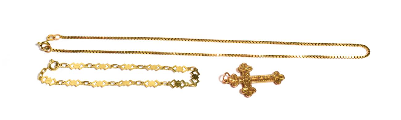 Lot 101 - A 9 carat gold bracelet, length 18cm; a 9 carat gold floral engraved cross pendant, measures...
