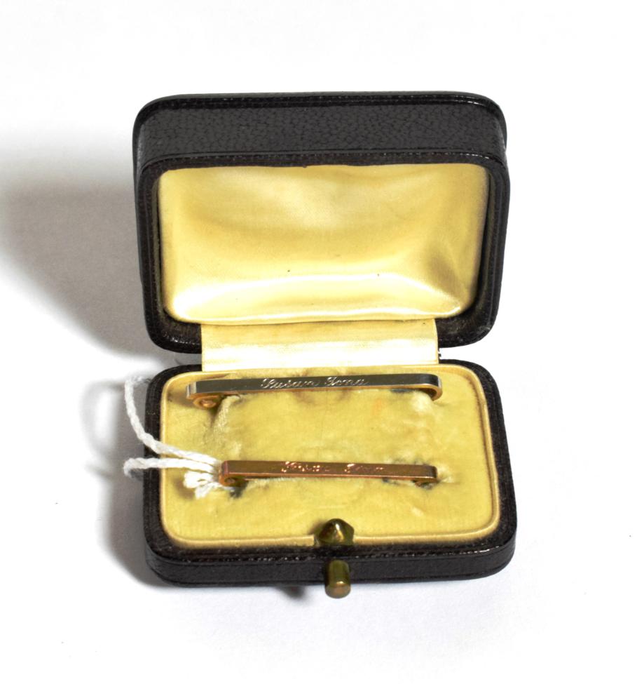 Lot 103 - Two bar brooches, lengths 3.1cm and 3.8cm, in a fitted case; and one earring, unmarked