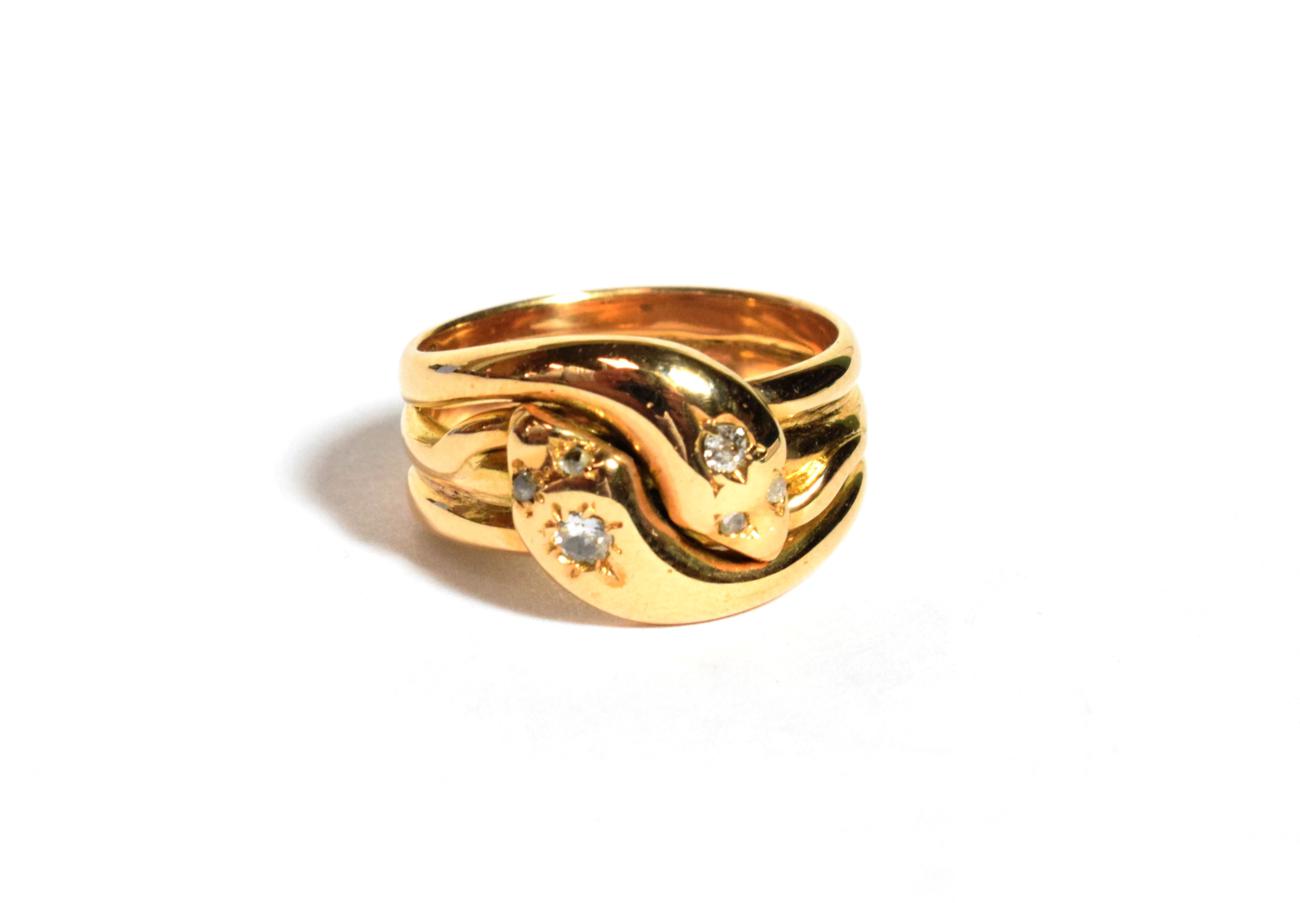 Lot 104 - An 18 carat gold diamond set snake ring, finger size P1/2