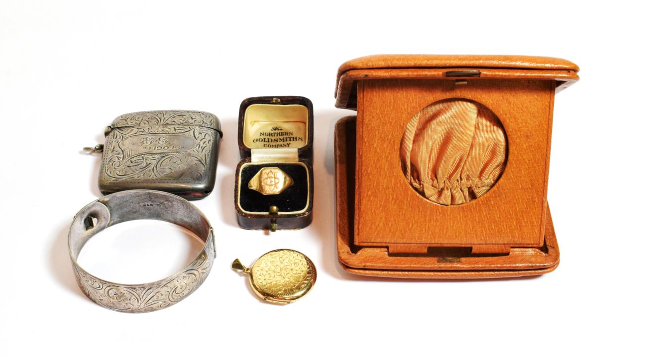 Lot 127 - A 9 carat gold signet ring, out of shape; a silver vesta; a silver bracelet; and a 9 carat gold...