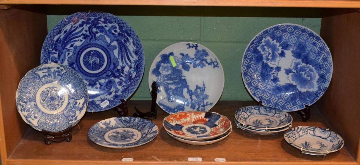 Lot 136 - A group of decorative Oriental blue and white and Imari chargers, plates and dishes (10)