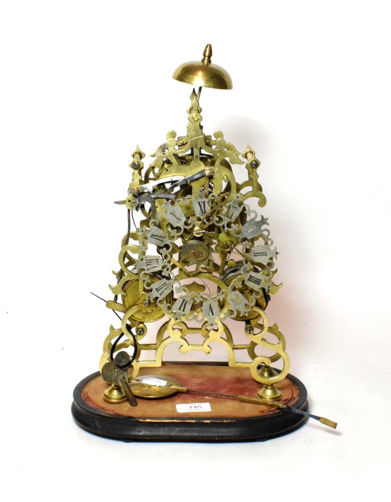Lot 145 - A brass striking skeleton clock