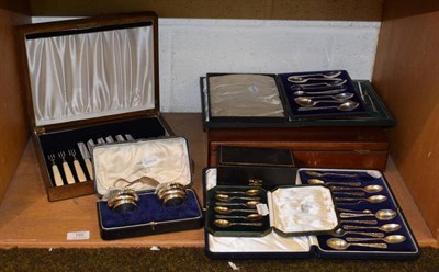 Lot 155 - Silver; a cased set of six coffee spoons in fitted Harrods box, a cased pair of napkin rings, a set