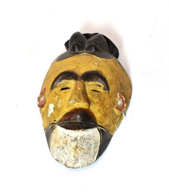 Lot 157 - A Punu carved wood face mask