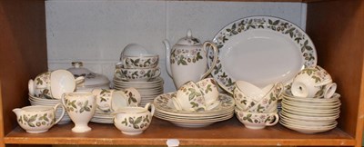 Lot 168 - A large service of Wedgewood strawberry hill patterned dinner wares (two shelves)