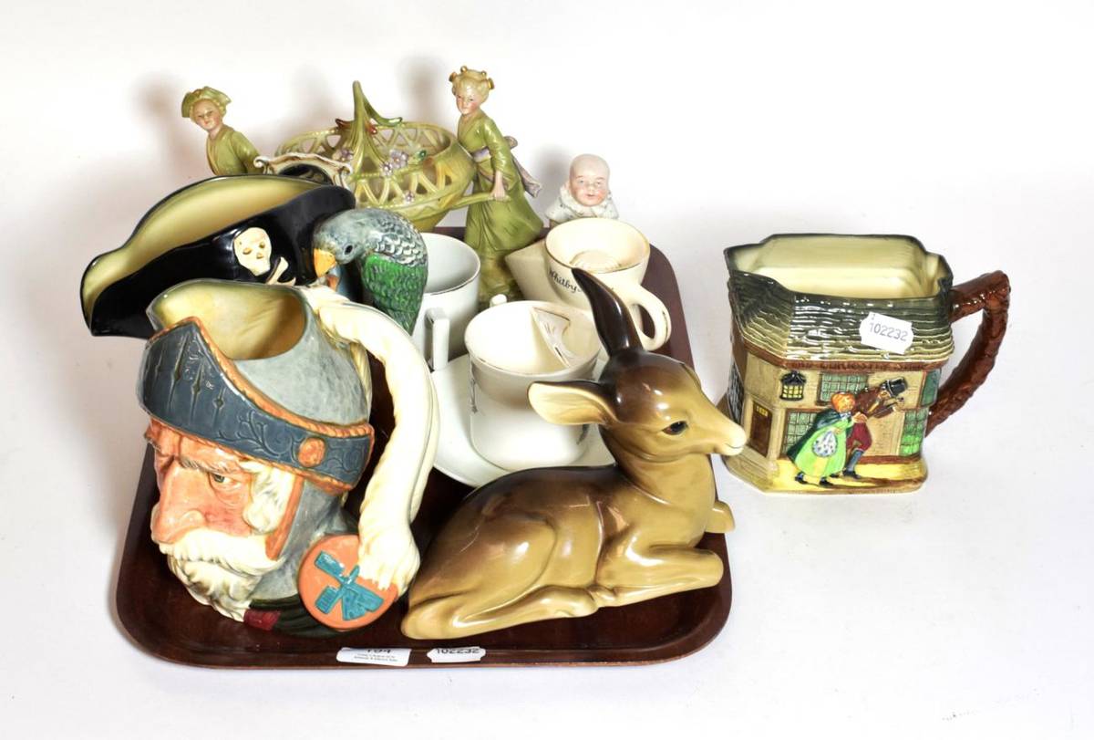 Lot 194 - A tray including two Doulton jugs; Old Curiosity Shop jug; Midwinter figure of a fawn; German...
