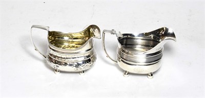 Lot 206 - Two George III silver cream jugs, one by George Murray, Newcastle, circa 1800, date letter and...