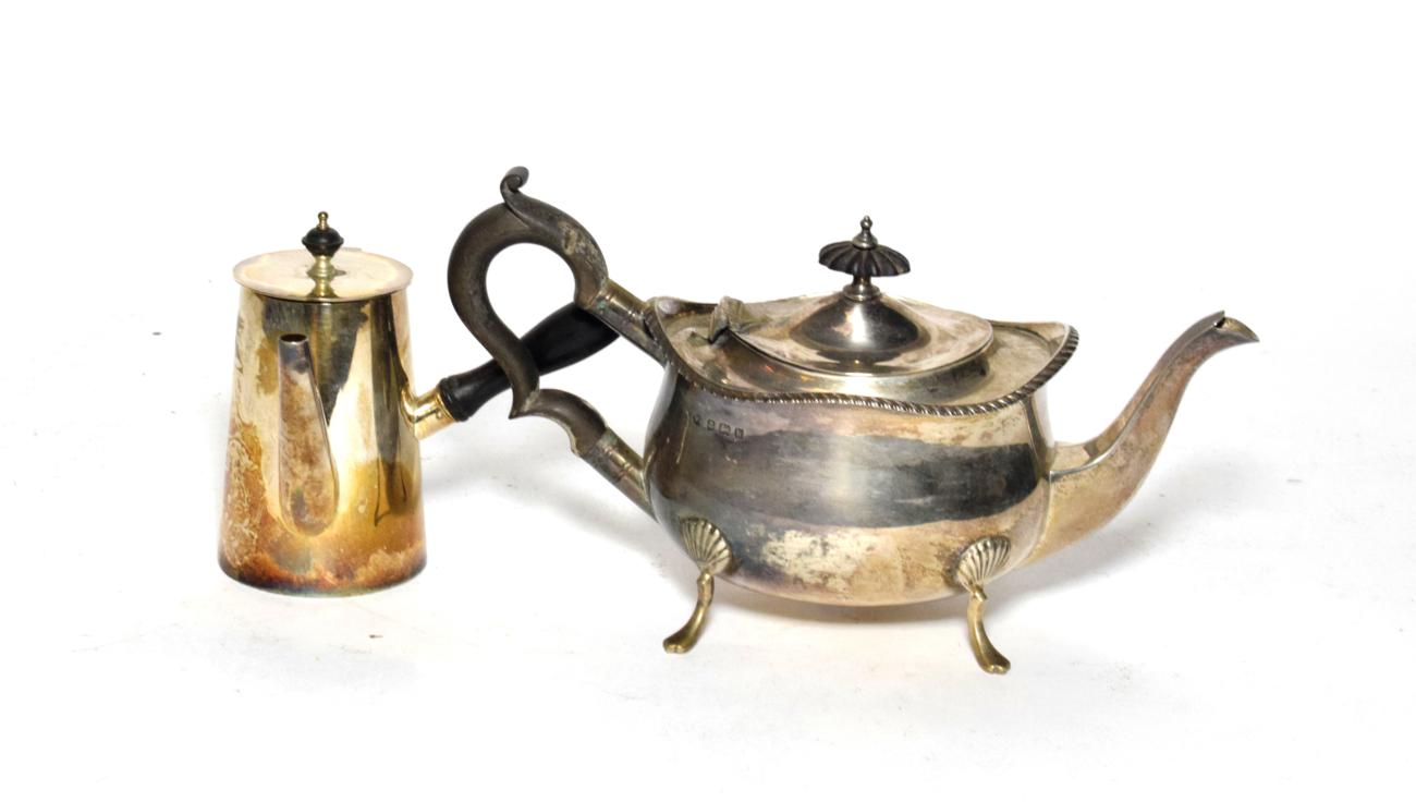 Lot 208 - An Edward VII silver teapot, by William Aitken, Birmingham, 1909, on four pad-feet, together...