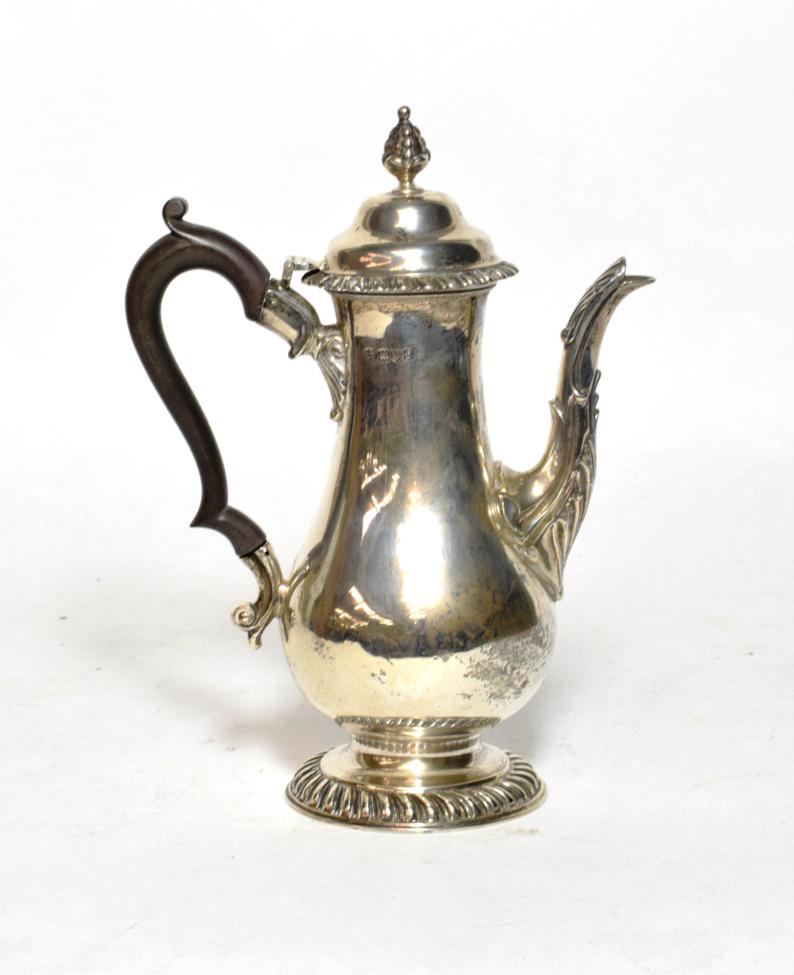Lot 215 - A Georgian style silver coffee pot, by Charles Stuart Harris, London, 1901 of baluster form...