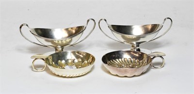 Lot 216 - A pair of Georgian style silver salt-cellars, each boat-shaped and on spreading foot, London,...