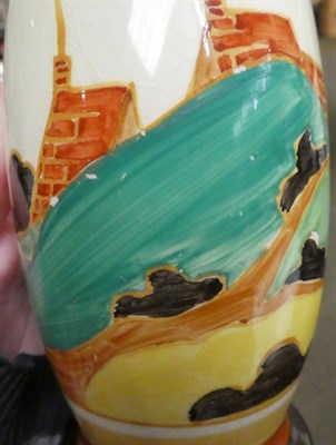 Lot 219 - A Clarice Cliff Fantasque Bizarre Vase, shape No. 265, decorated with red roofs and landscape