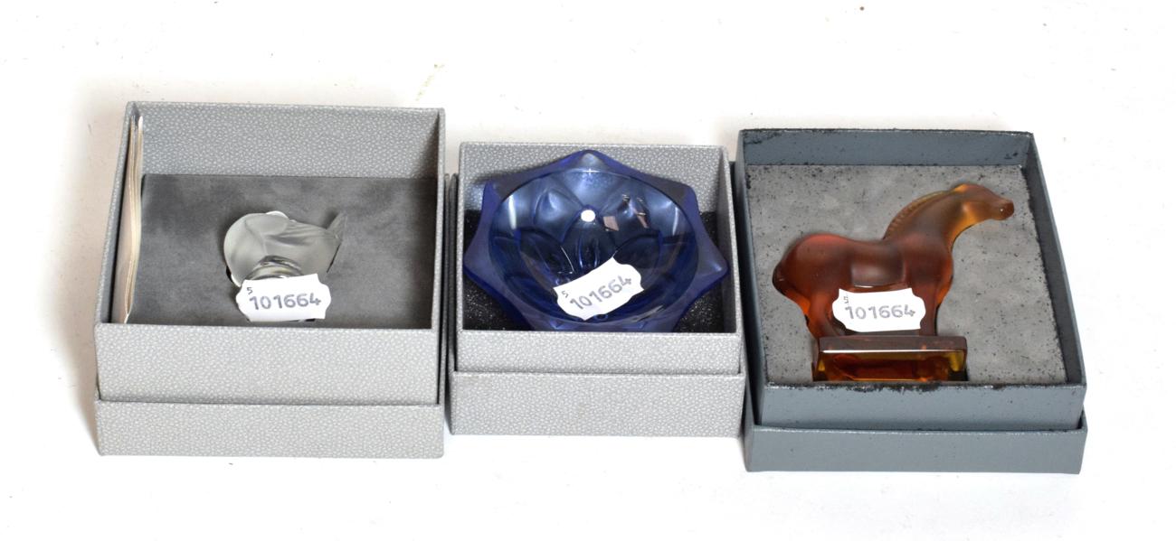 Lot 223 - A Lalique Tang style amber glass horse paperweight, boxed; with two others (3)