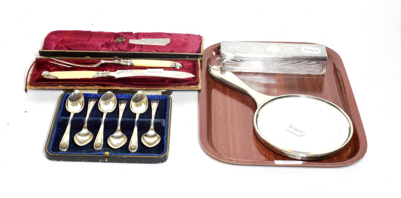 Lot 224 - A set of six silver grapefruit spoons; a cased carving set; a mirror and a dressing table box