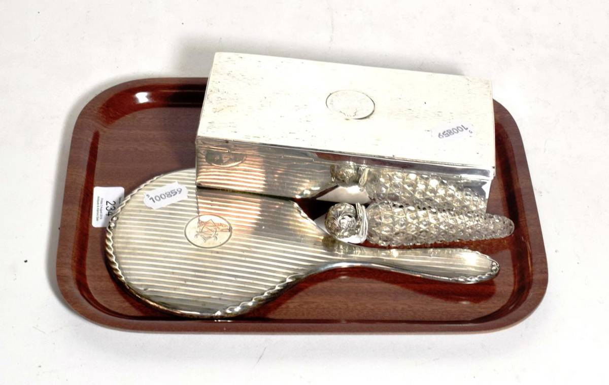 Lot 234 - A silver topped scent bottle; a cigarette box and mirror (3)