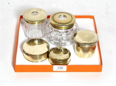 Lot 236 - Five silver or silver-mounted dressing table-jars, comprising: three circular silver examples,...