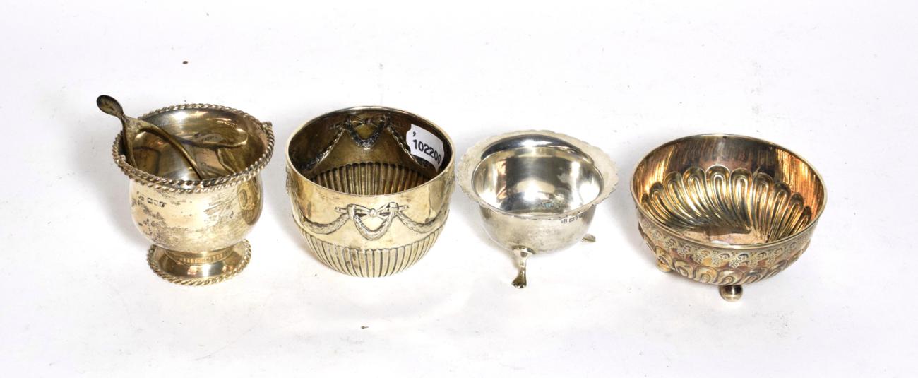 Lot 237 - Four silver sugar-bowls, comprising: one on paw feet, Chester, 1909. one of circular section on...