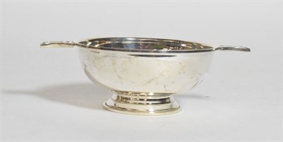 Lot 242 - An Elizabeth II silver quaich, by Broadway and Co., Birmingham, 2006, the bowl circular and...