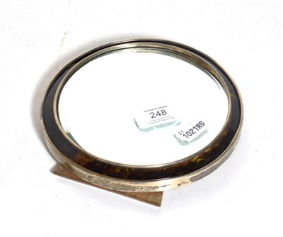 Lot 248 - A George V silver and tortoiseshell mirror, Birmingham, 1918, circular and with easel back, as...