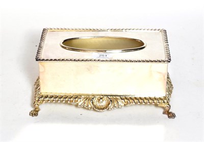 Lot 251 - A silver-plated tissue box-holder, oblong and on paw feet, with shell and foliage heightened...