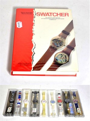 Lot 258 - Nine Swatch watches in plastic cases, all with new batteries and a Swatcher Collectables book