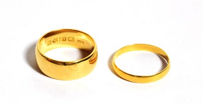 Lot 286 - An 18 carat gold band ring, finger size K; and a 22 carat gold band ring, finger size K1/2