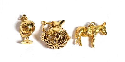 Lot 297 - Three 9 carat gold charms, including; an ewer, a donkey and a globe