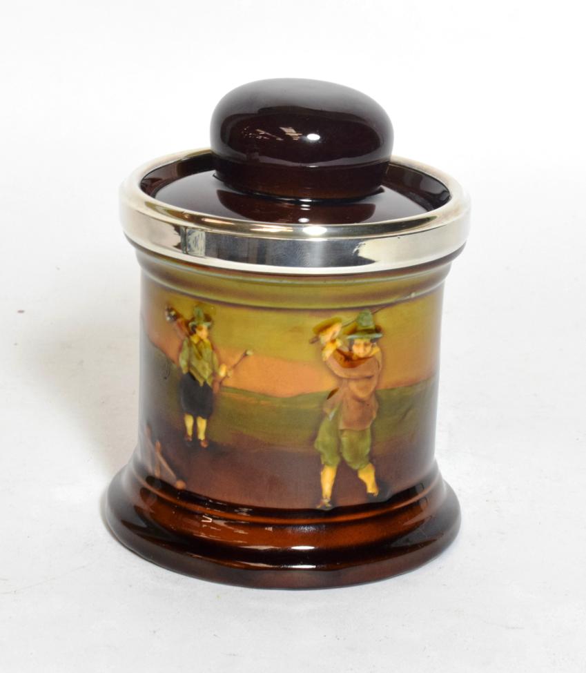Lot 314 - A Royal Doulton golf Kingsware series tobacco jar with silver rim