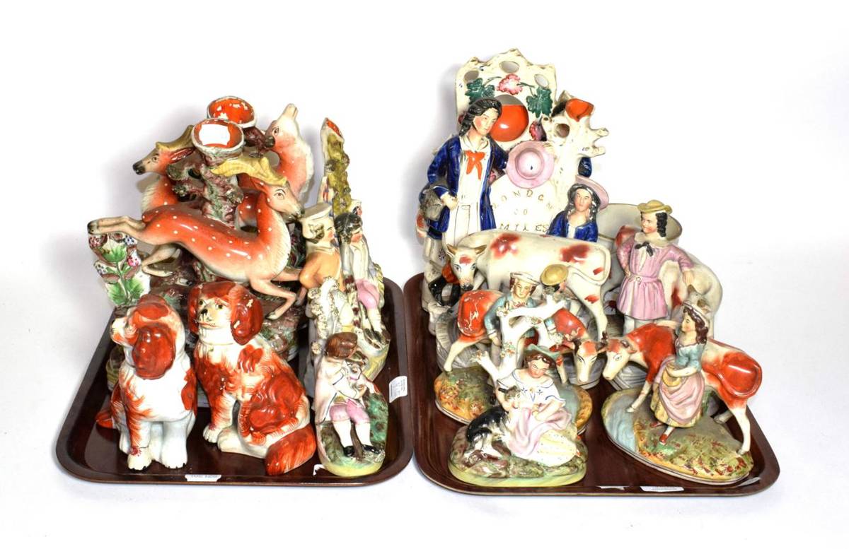 Lot 321 - A quantity of Staffordshire flat back figures, spill vases, seated spaniels, frog mug etc