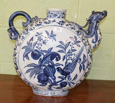 Lot 323 - A large Chinese blue and white moon form ewer, hand painted with parrots, 44cm height